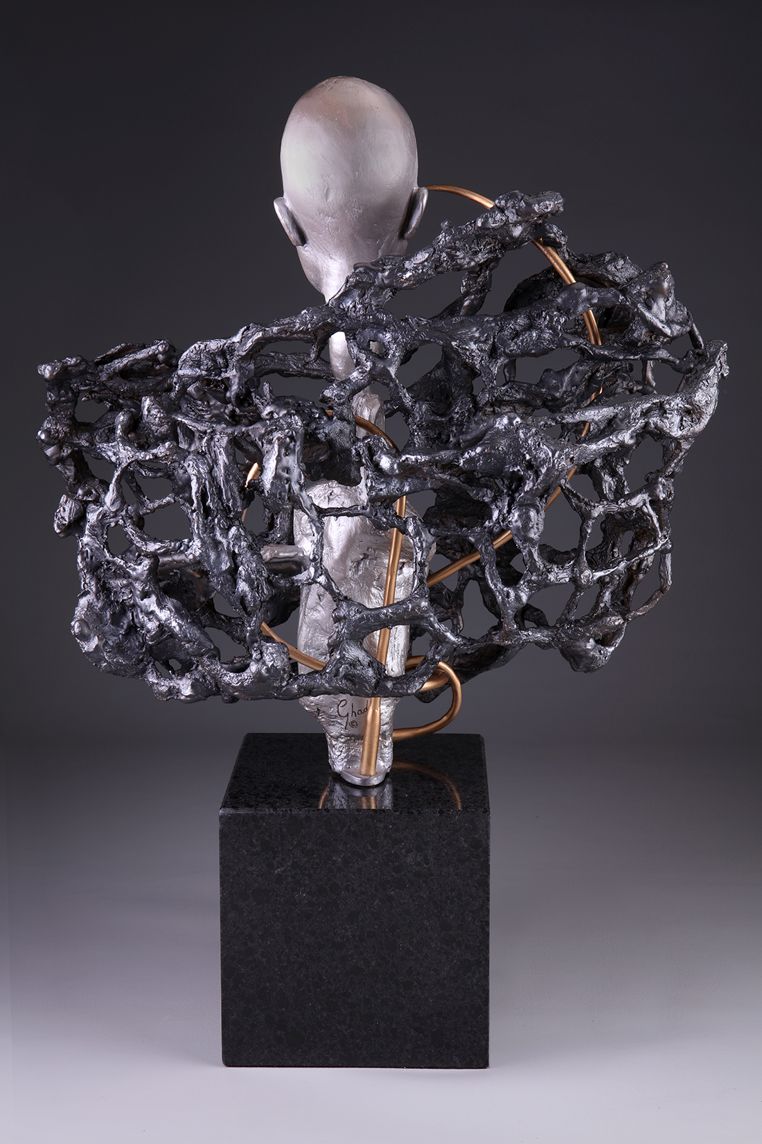 Consumed bronze sculpture back view